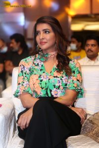 mohan babu daughter and actress Lakshmi Manchu in a green shirt at an event