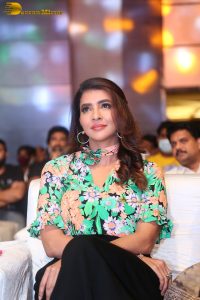 mohan babu daughter and actress Lakshmi Manchu in a green shirt at an event