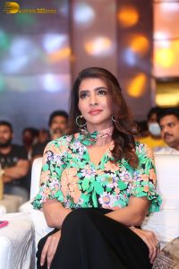 mohan babu daughter and actress Lakshmi Manchu in a green shirt at an event