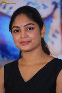 actress Lavannya Sahukara cute stills a black sleeveless dress