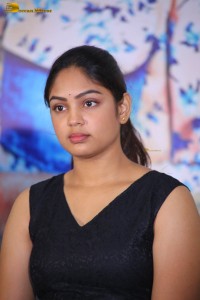 actress Lavannya Sahukara cute stills a black sleeveless dress