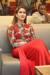 actress Lavanya Tripathi in a red floral dress at a movie event