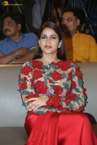 actress Lavanya Tripathi in a red floral dress at a movie event