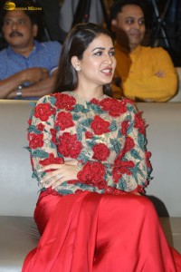 actress Lavanya Tripathi in a red floral dress at a movie event