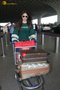 Actress Laxmi Raai in a green sweater at Mumbai Airport