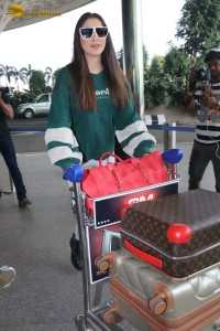 Actress Laxmi Raai in a green sweater at Mumbai Airport