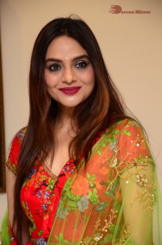 Tamil and Telugu Actress Madhubala in a red and green dress