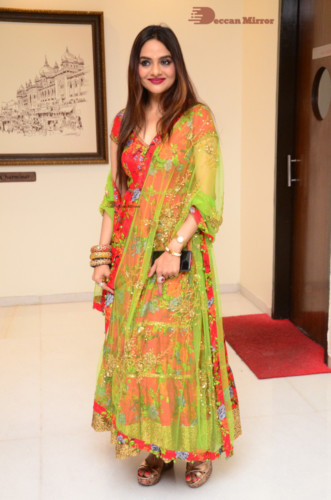 Tamil and Telugu Actress Madhubala in a red and green dress