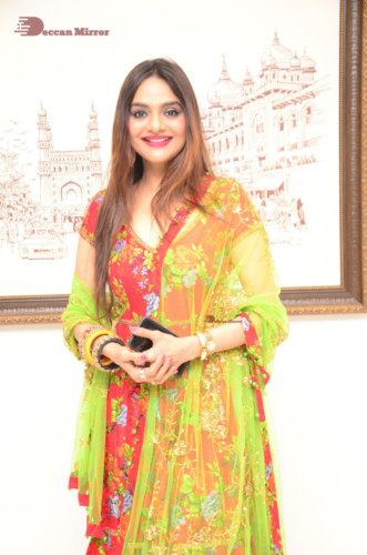 Tamil and Telugu Actress Madhubala in a red and green dress