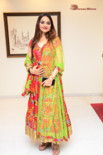 Tamil and Telugu Actress Madhubala in a red and green dress