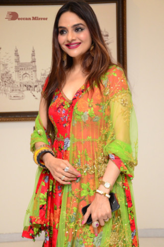 Tamil and Telugu Actress Madhubala in a red and green dress