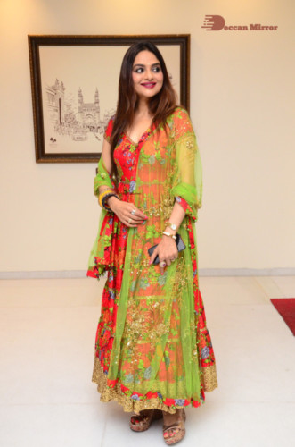 Tamil and Telugu Actress Madhubala in a red and green dress
