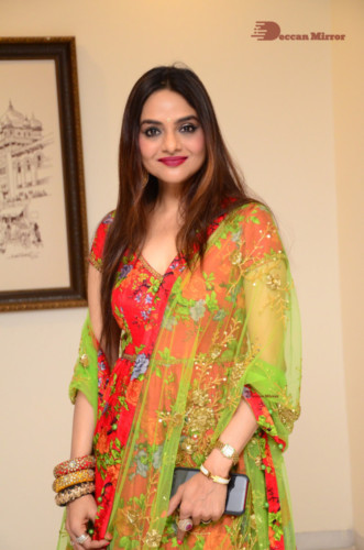 Tamil and Telugu Actress Madhubala in a red and green dress