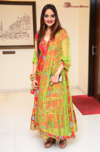 Tamil and Telugu Actress Madhubala in a red and green dress