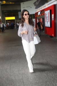actress Madhuri Dixit spotted at mumbai airport in a long sleeves shirt