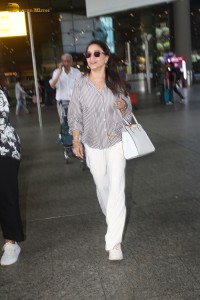 actress Madhuri Dixit spotted at mumbai airport in a long sleeves shirt