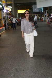 actress Madhuri Dixit spotted at mumbai airport in a long sleeves shirt