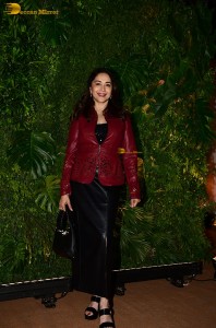 bollywood actress Madhuri Dixit in a red suit and black trousers