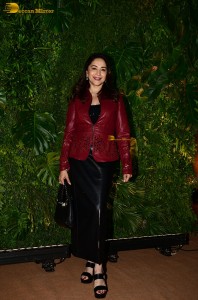 bollywood actress Madhuri Dixit in a red suit and black trousers