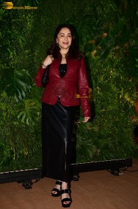 bollywood actress Madhuri Dixit in a red suit and black trousers