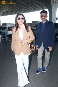 Bollywood star actress Madhuri Dixit spotted with her husband at mumbai airport