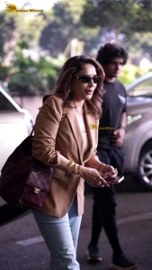 bollywood star Madhuri Dixit gorgeous in a beige color jacket at airport