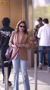 bollywood star Madhuri Dixit gorgeous in a beige color jacket at airport