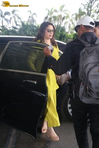 madhuri dixit in yellow dress at mumbai airport