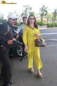 madhuri dixit in yellow dress at mumbai airport