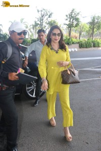 madhuri dixit in yellow dress at mumbai airport