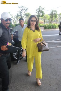 madhuri dixit in yellow dress at mumbai airport