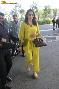 madhuri dixit in yellow dress at mumbai airport