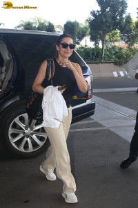 malaika arora in sunglasses and stylish attire at airport