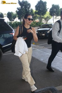 malaika arora in sunglasses and stylish attire at airport