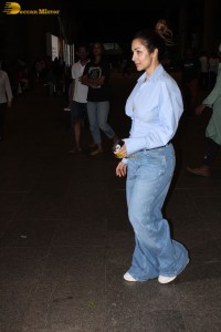 actress Malaika Arora stylish look in a blue shirt and denim jeans