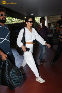 actress malaika arora in a white track suit at airport