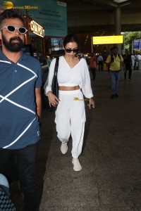 actress malaika arora in a white track suit at airport