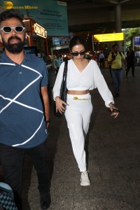 actress malaika arora in a white track suit at airport