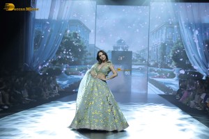 bollywood actress Malaika Arora ramp walk in a green lehenga choli dress