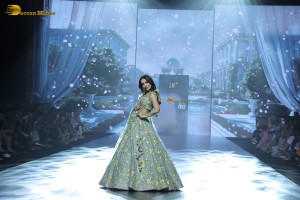 bollywood actress Malaika Arora ramp walk in a green lehenga choli dress