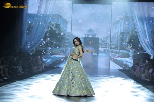 bollywood actress Malaika Arora ramp walk in a green lehenga choli dress