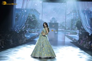 bollywood actress Malaika Arora ramp walk in a green lehenga choli dress