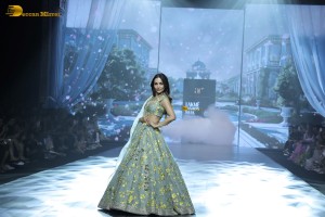 bollywood actress Malaika Arora ramp walk in a green lehenga choli dress
