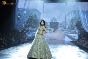 bollywood actress Malaika Arora ramp walk in a green lehenga choli dress