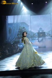 bollywood actress Malaika Arora ramp walk in a green lehenga choli dress