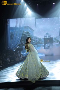 bollywood actress Malaika Arora ramp walk in a green lehenga choli dress