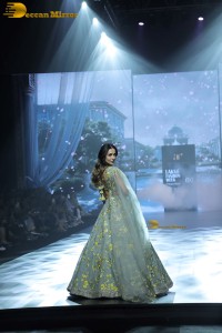 bollywood actress Malaika Arora ramp walk in a green lehenga choli dress