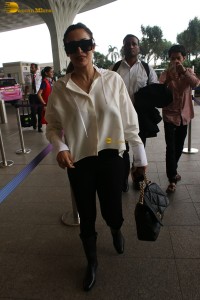 actress malaika arora in white shirt and sunglasses