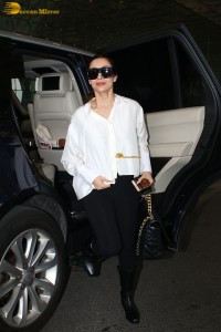 actress malaika arora in white shirt and sunglasses