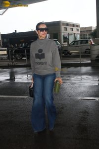actress Malaika Arora chic look in t-shirt and jeans at mumbai airport
